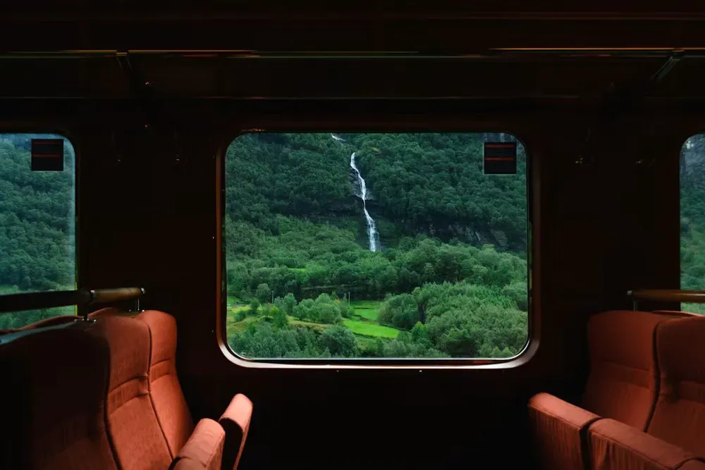 A view of a waterfall from the Bergensbanen train from Oslo to Bergen