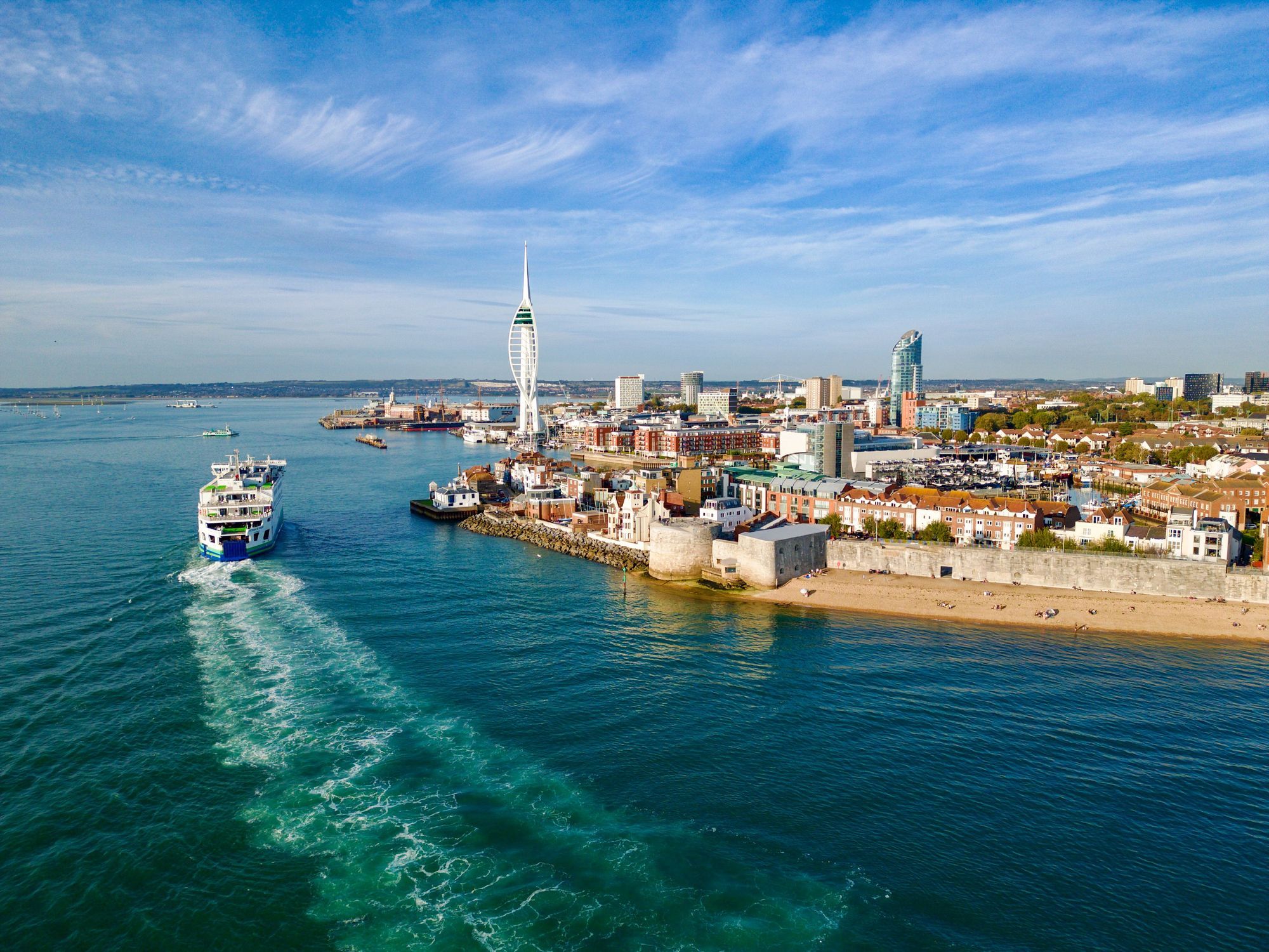 Aerial_view_of_Portsmouth_harbor_with_the_Spinnaker_Tower_ferry_and_coastline_under_a_clear_blue_sky_72d95501dd.jpg