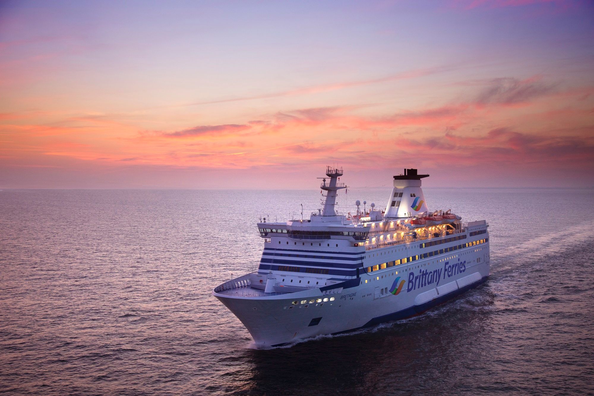 Brittany Ferries ship sailing at dusk