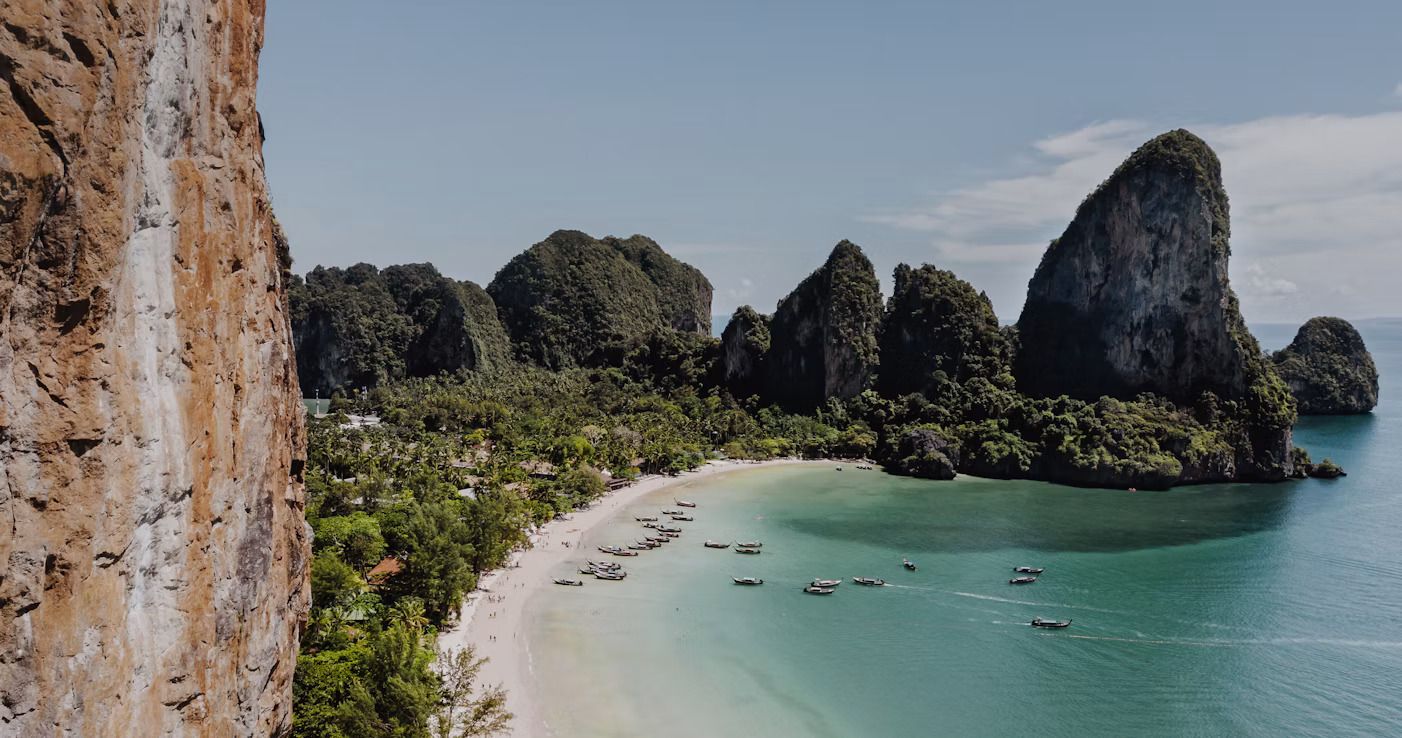 Railay Beach surrounded by dense rainforest and limestone karsts.jpg