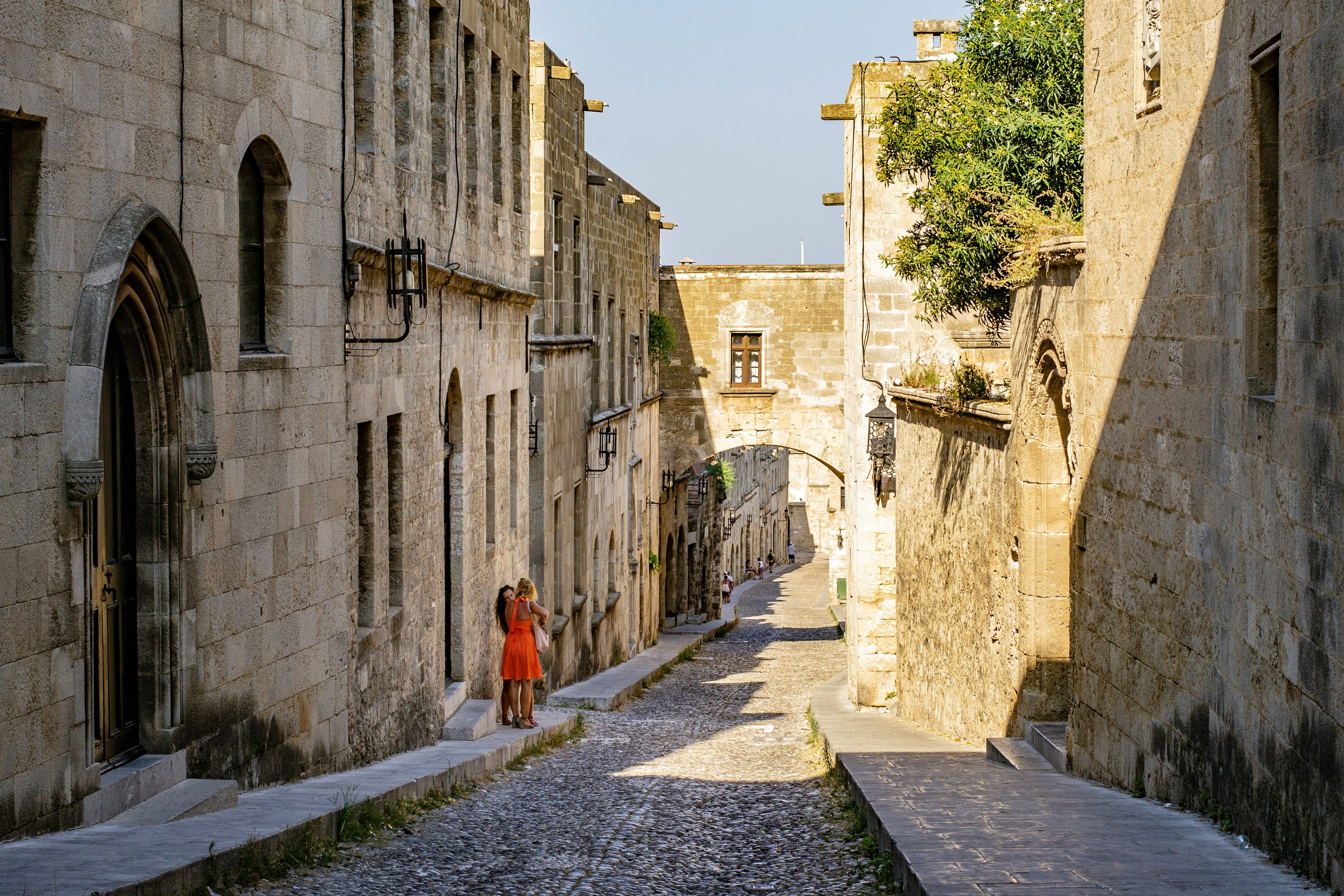 people stood on a cobbled street