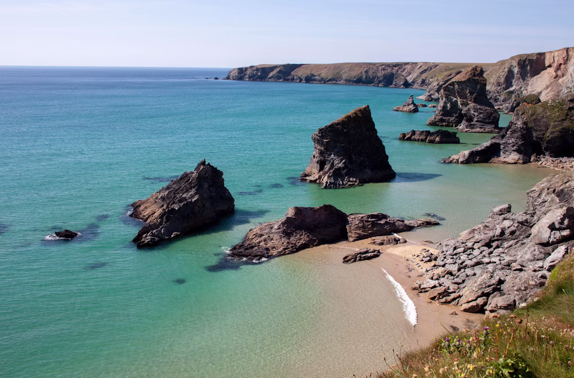 sandy beach with clear waters in Saint Agnes in Cornwall