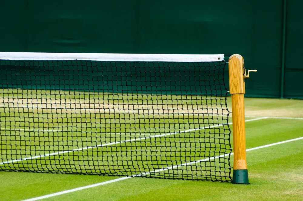 The tennis net at Wimbledon secured in place by a wooden post