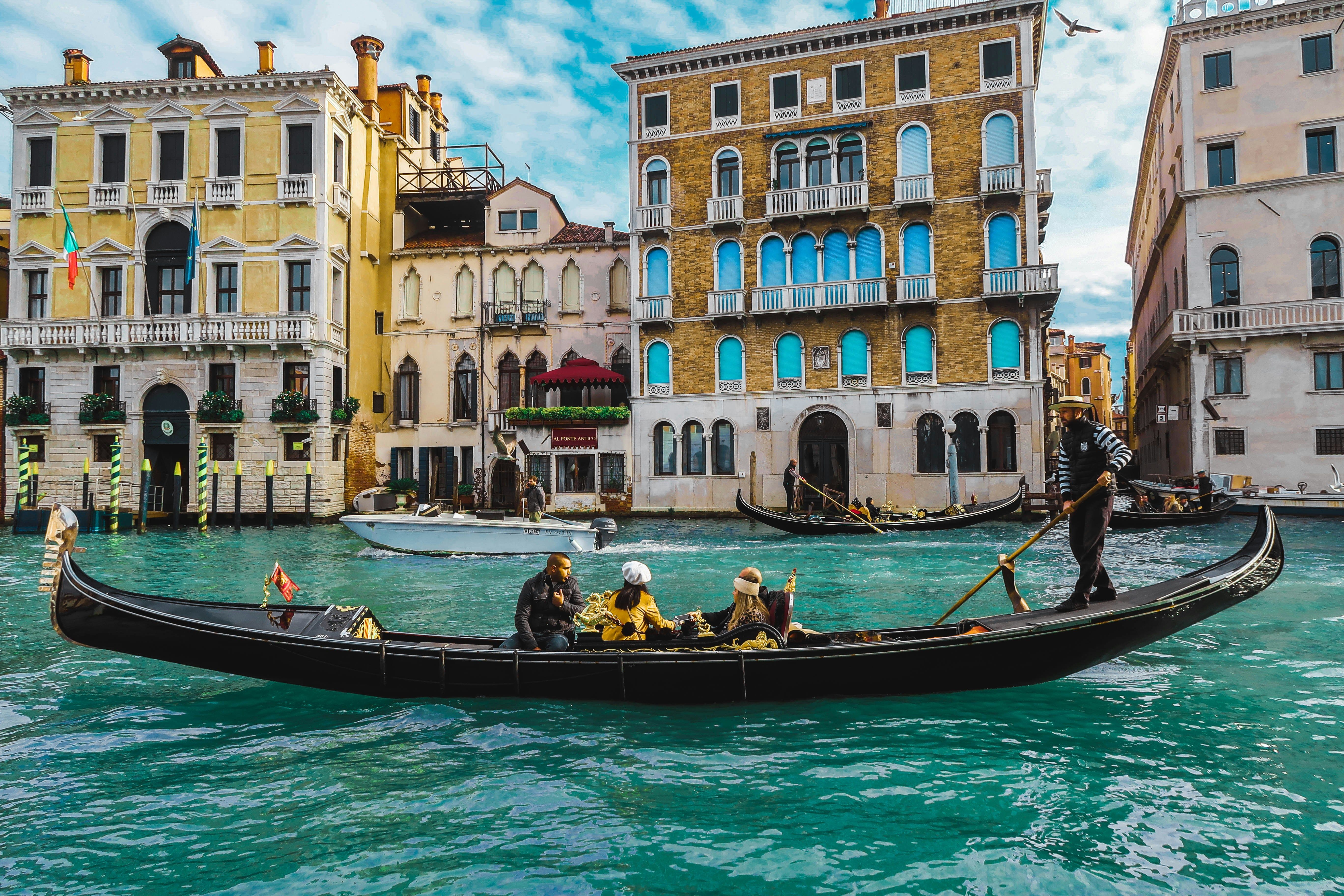 people on a gondola in Venice