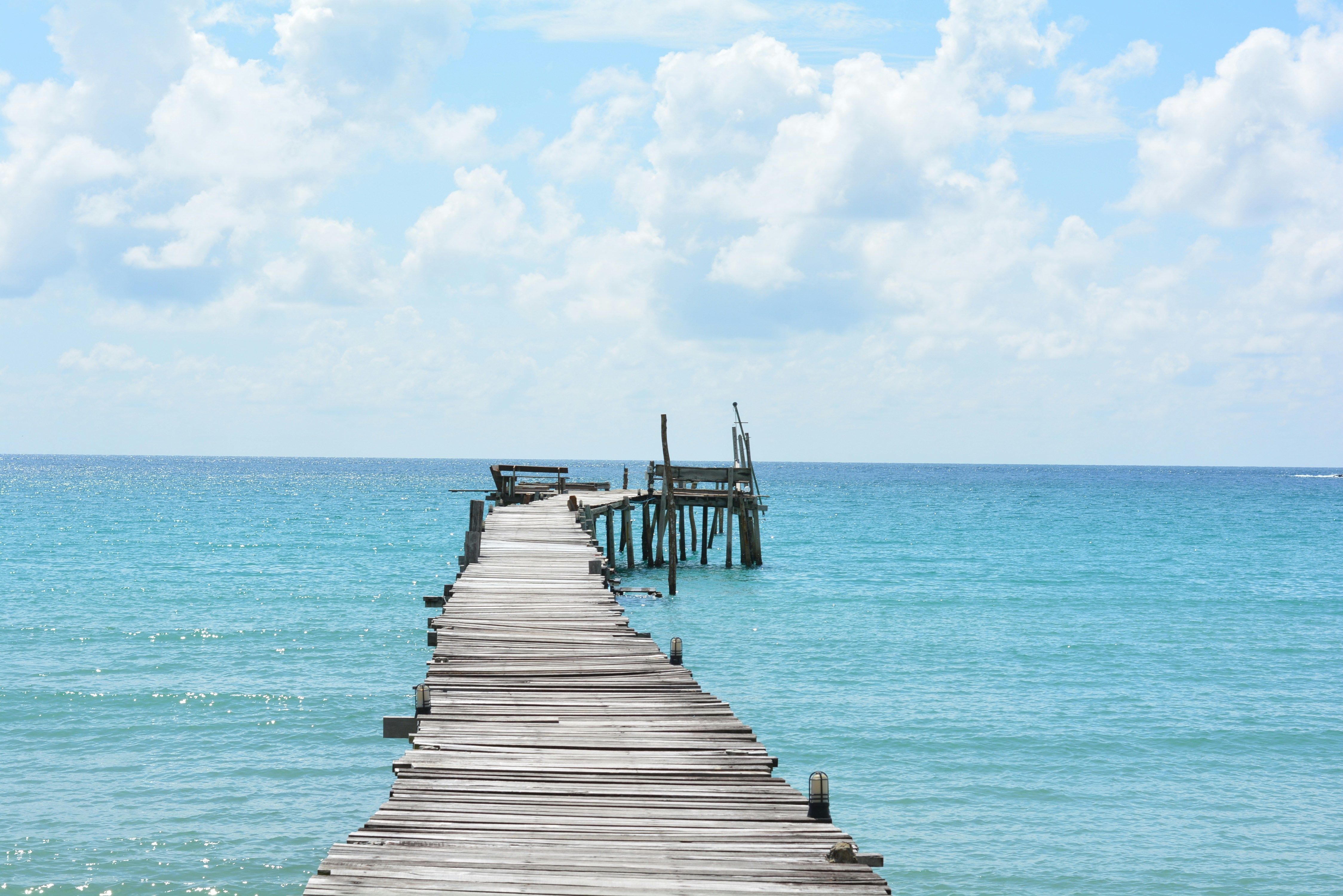 pier jutting out into the clear seas in Koh Kood