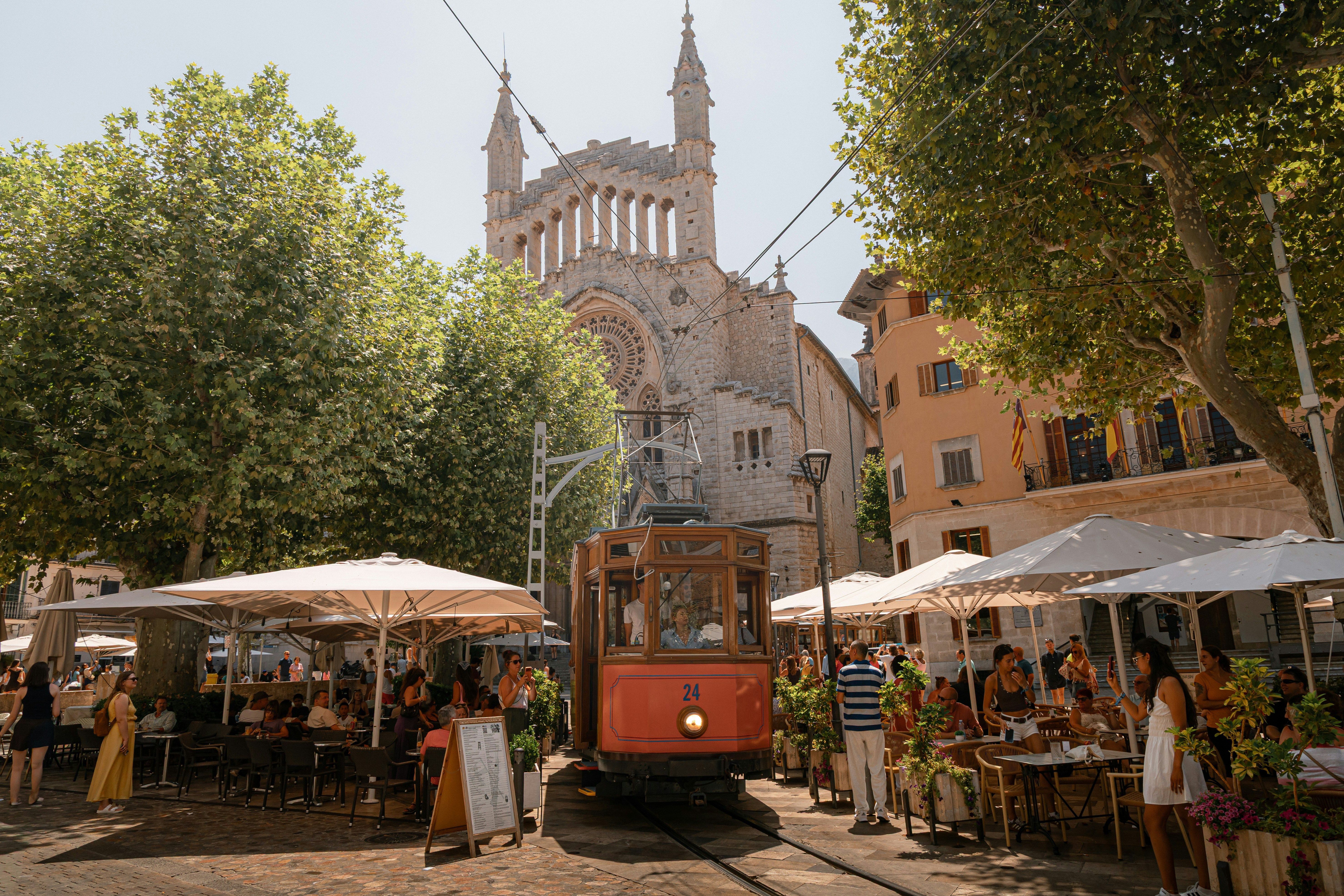 tram going through Plaça de la Constitució in Soller