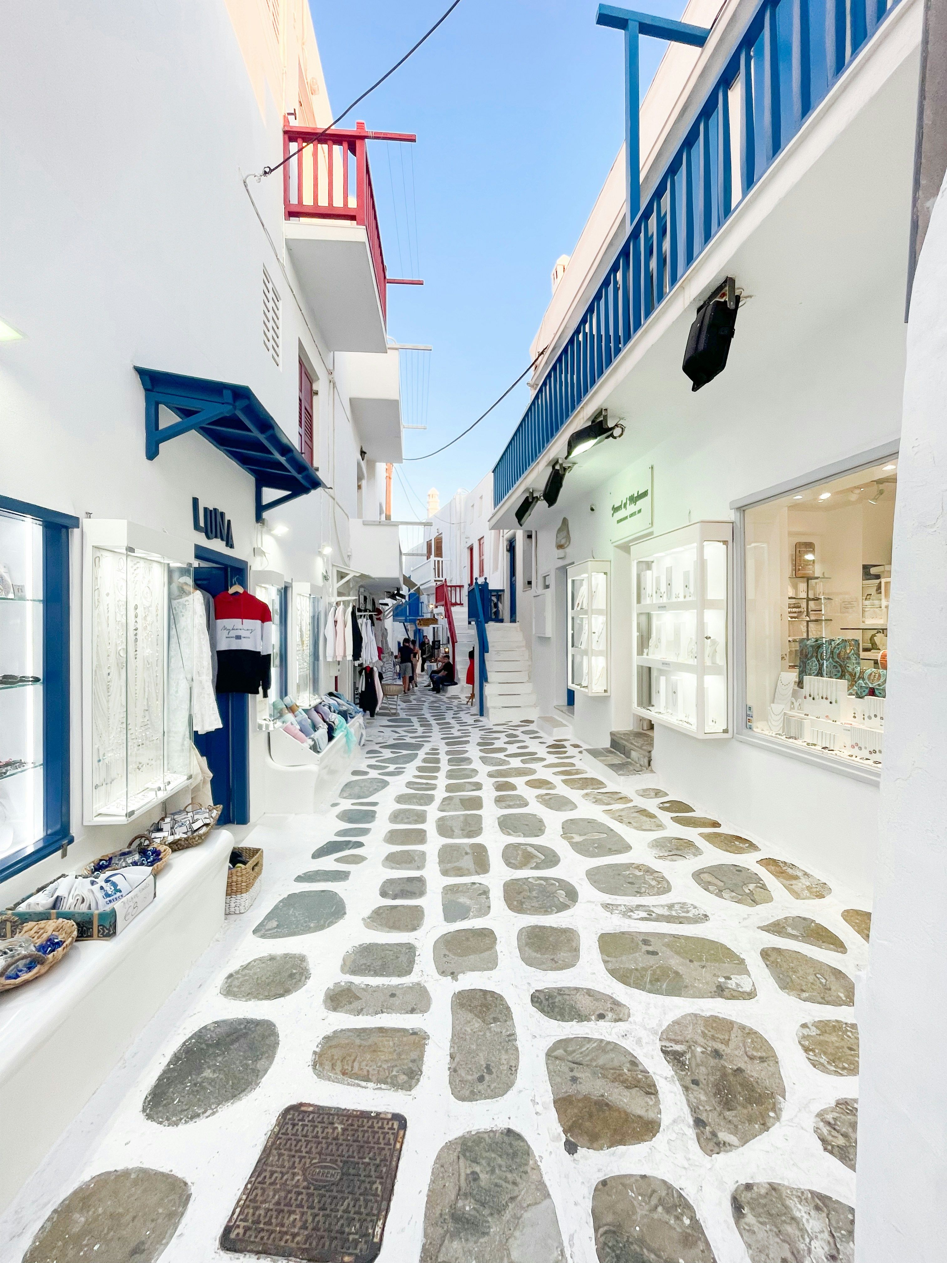 narrow white and blue cobblestone street