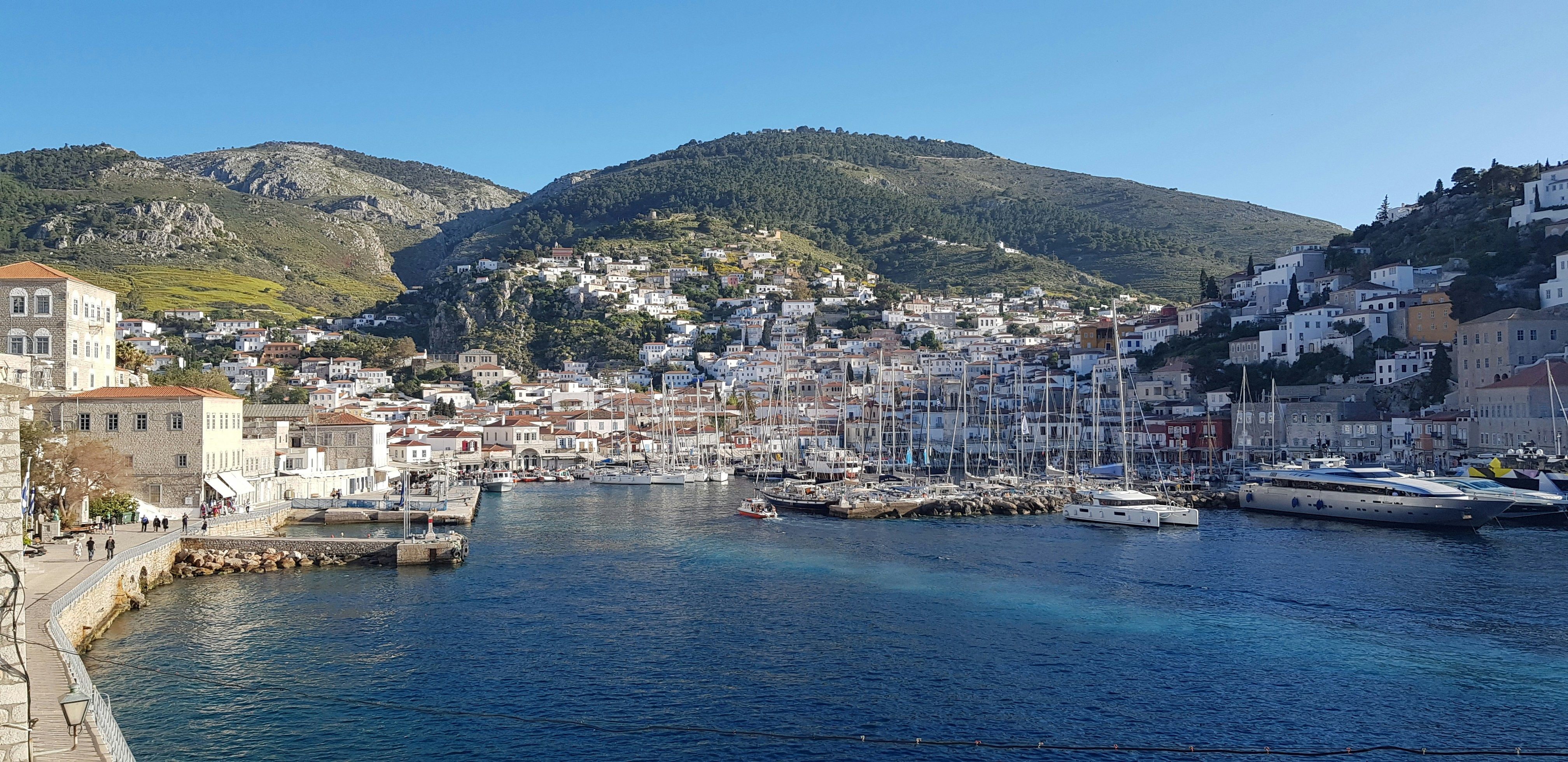 Hydra port with green hills behind
