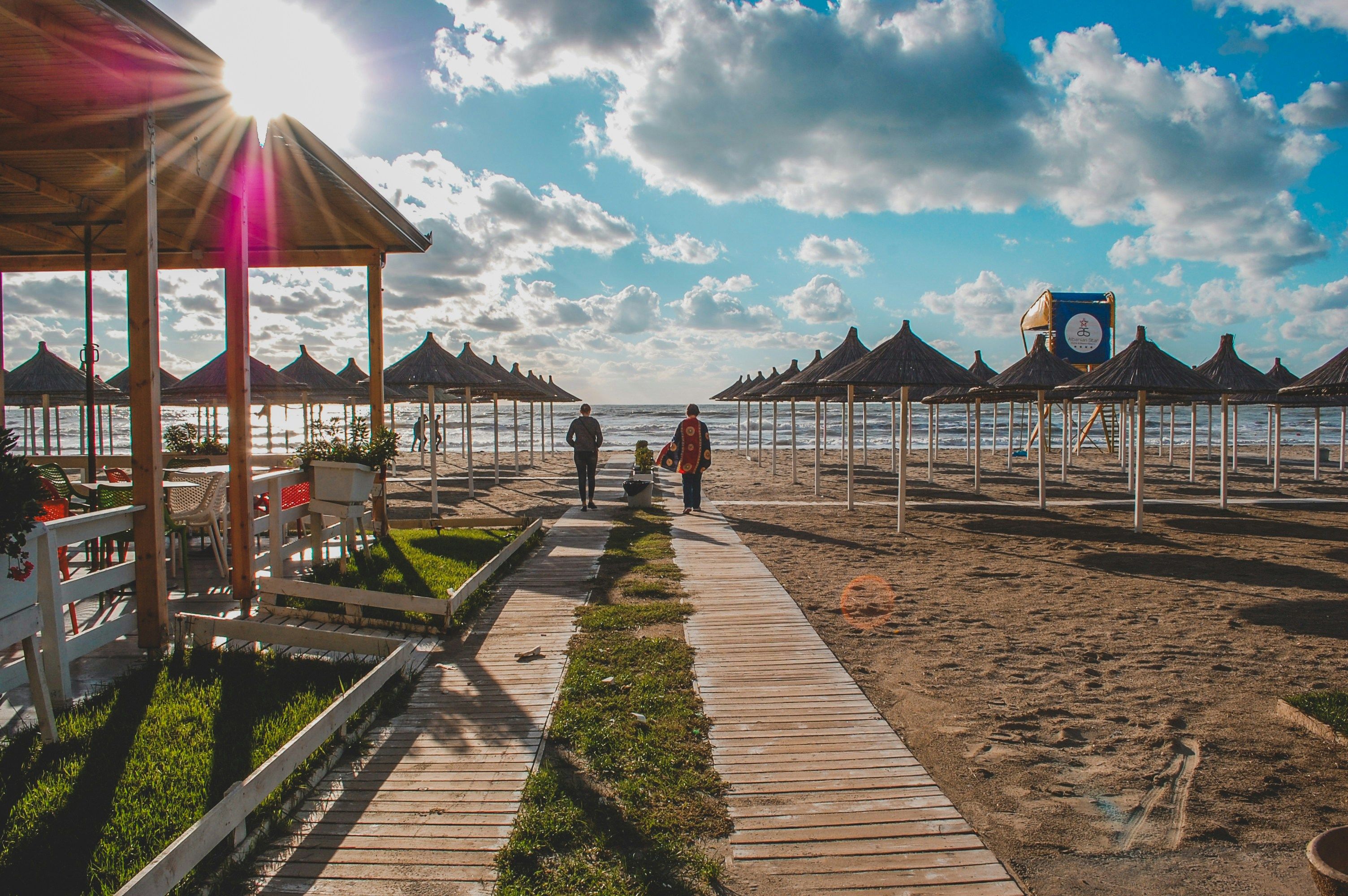 people walking down a beach in Durres