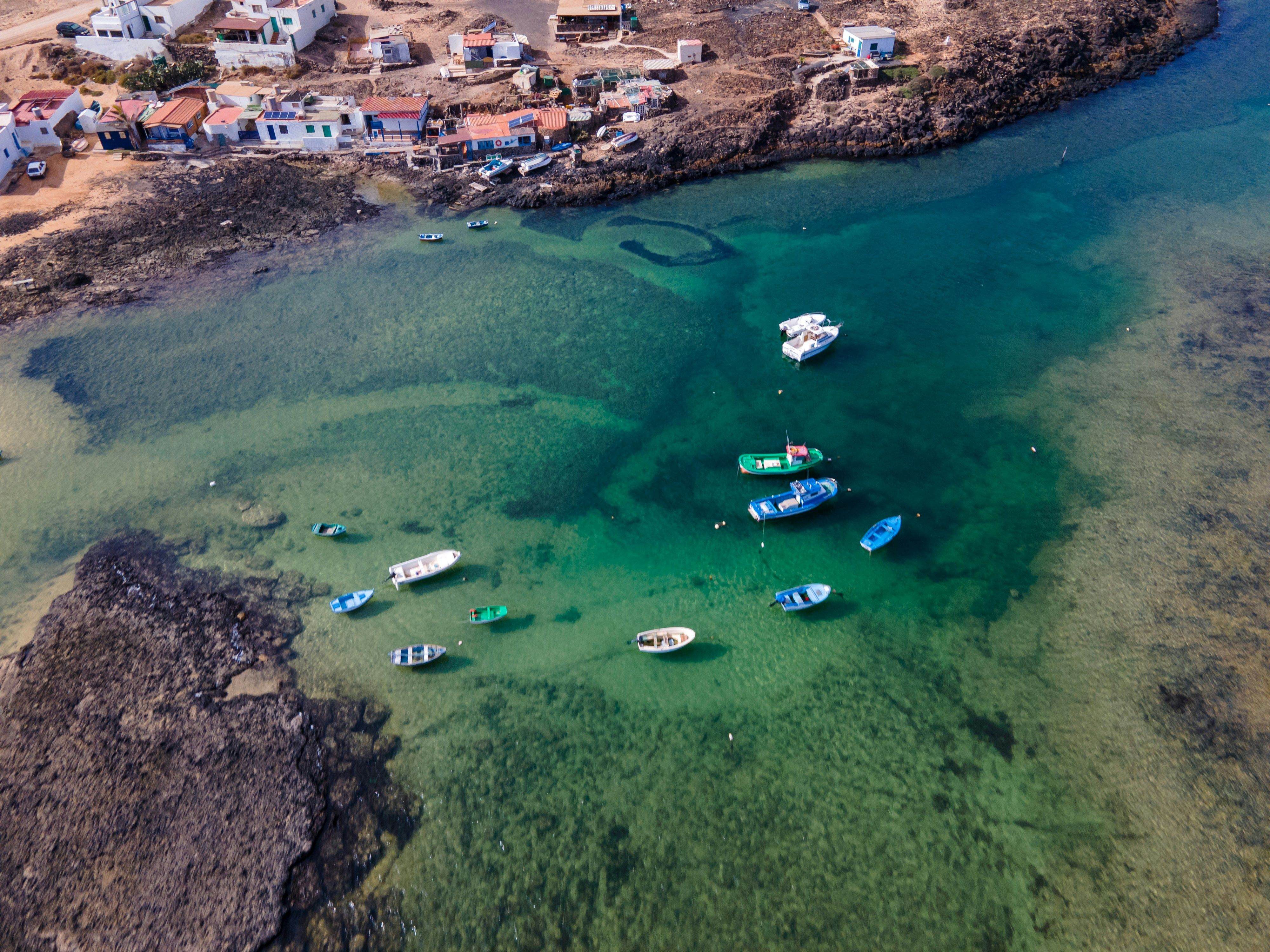 boats in the sea off the coast of Corralejo