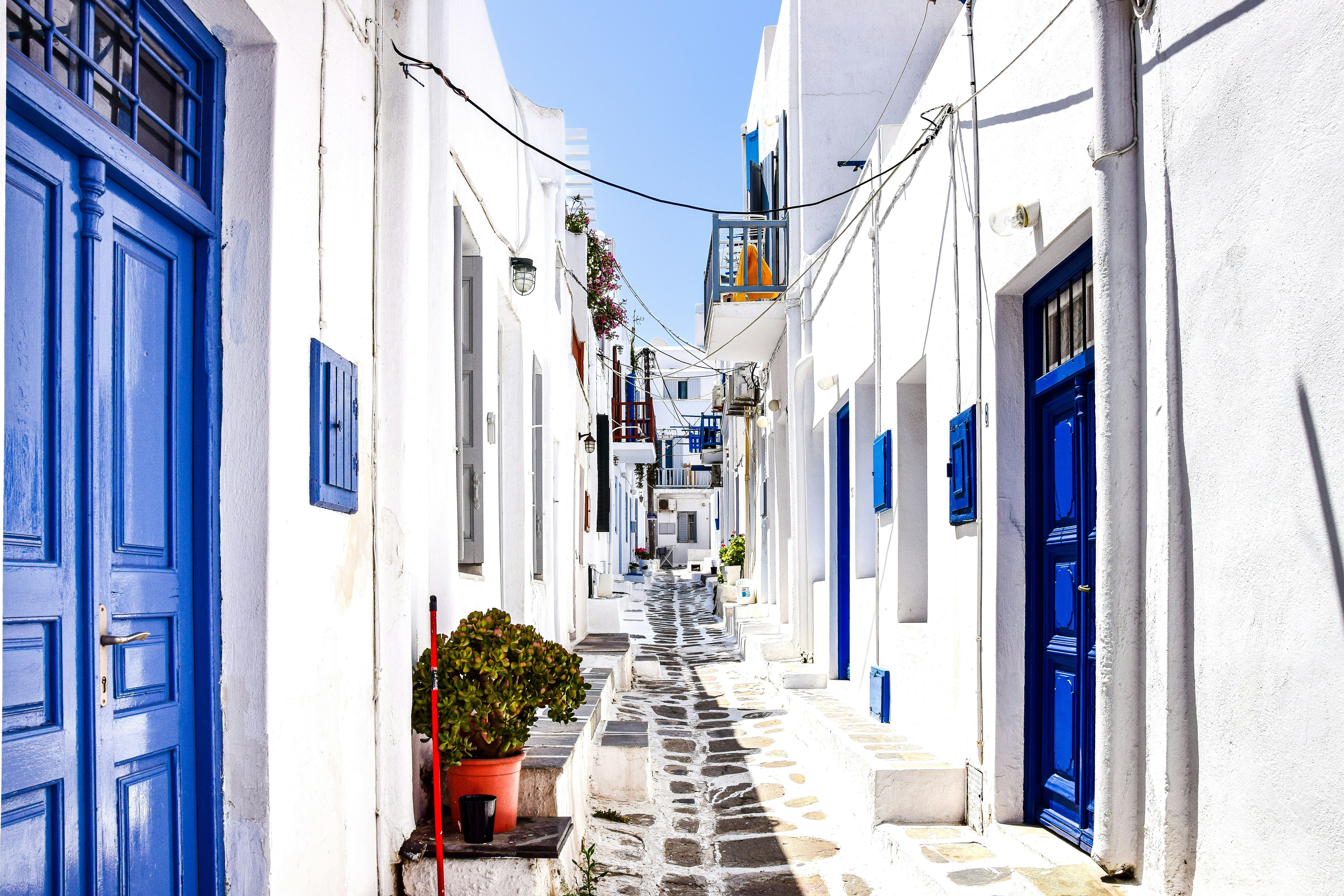 narrow blue and white street in Mykonos