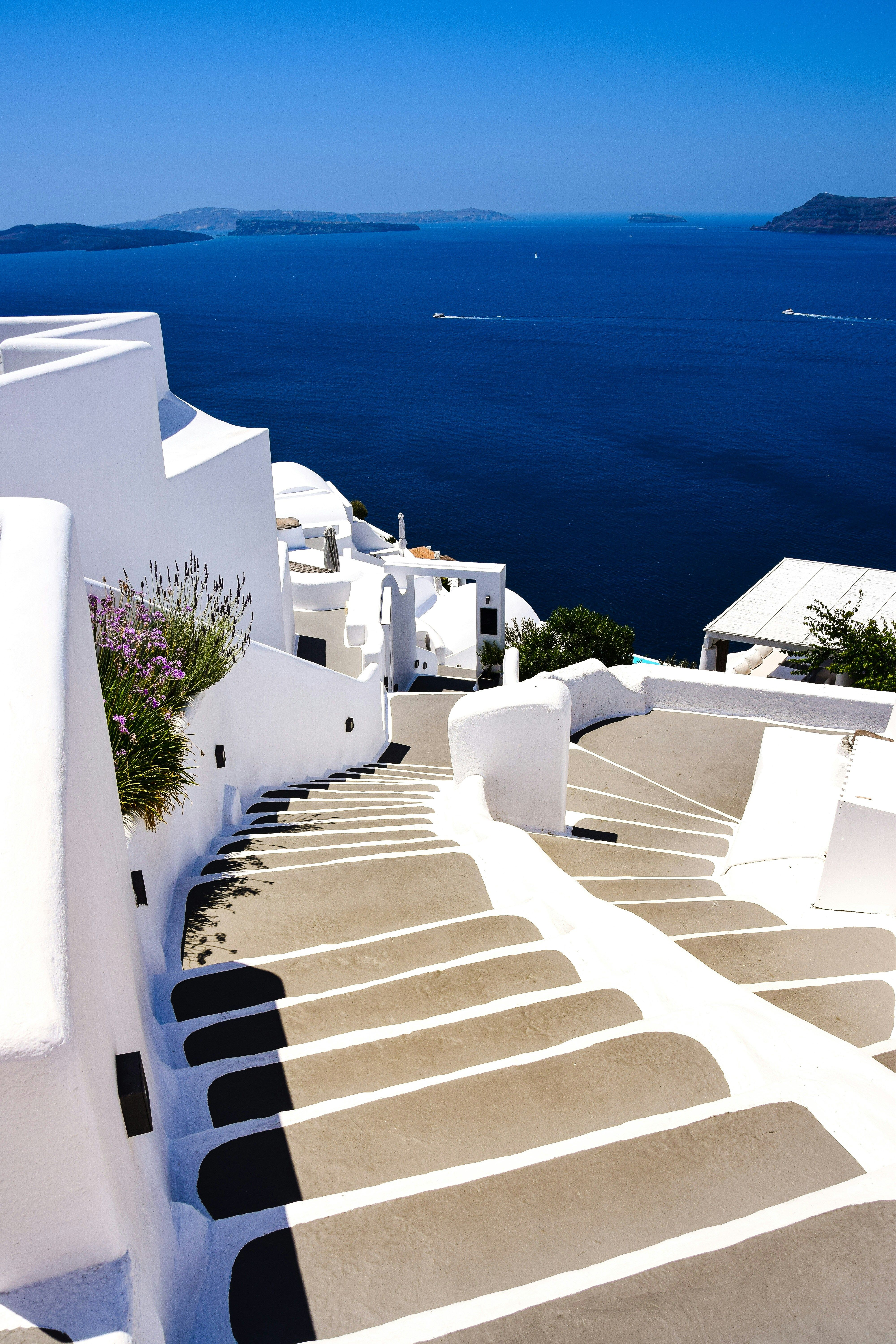 white staircase leading down to the sea