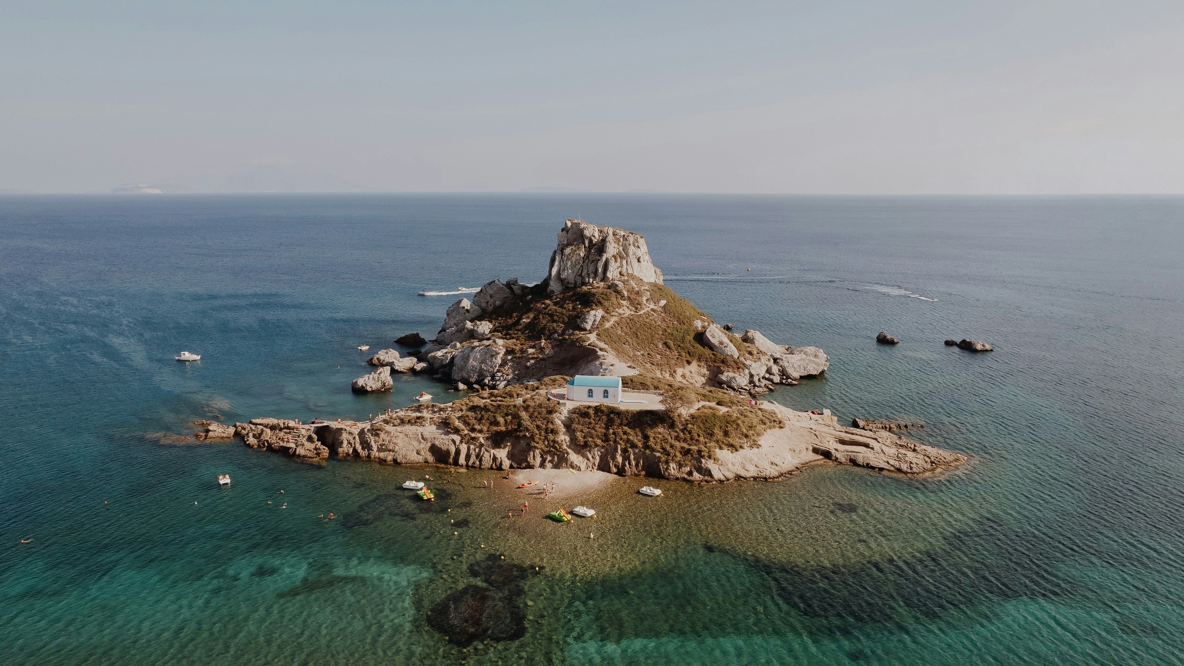 small rocky island off the coast