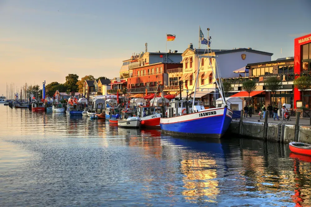 boats lined up along a promenade