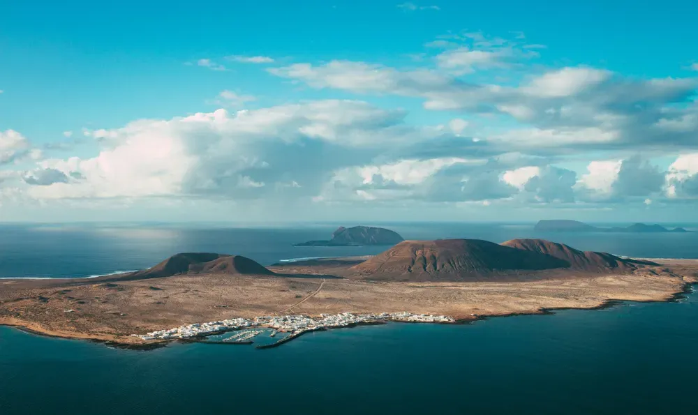 brown mountains on Lanzarote island surrounded by sea