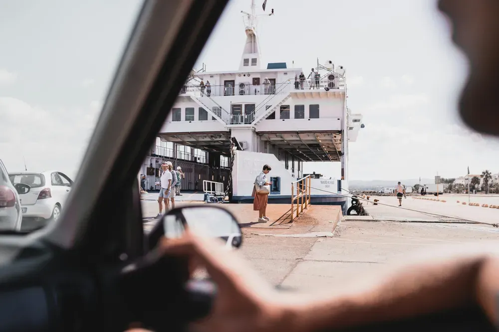 car queing to board a ship