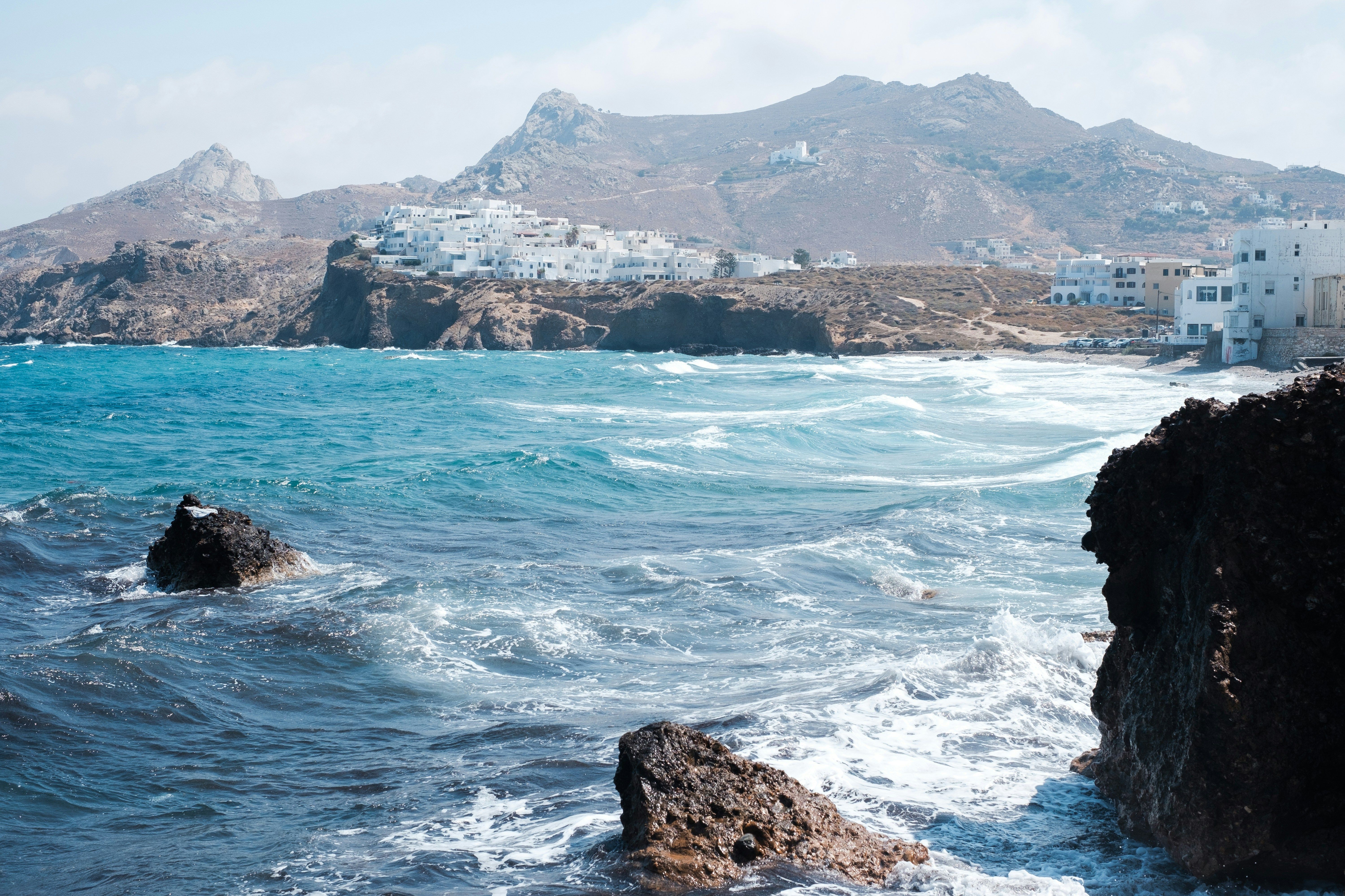 rocks in the sea with Naxos in the background