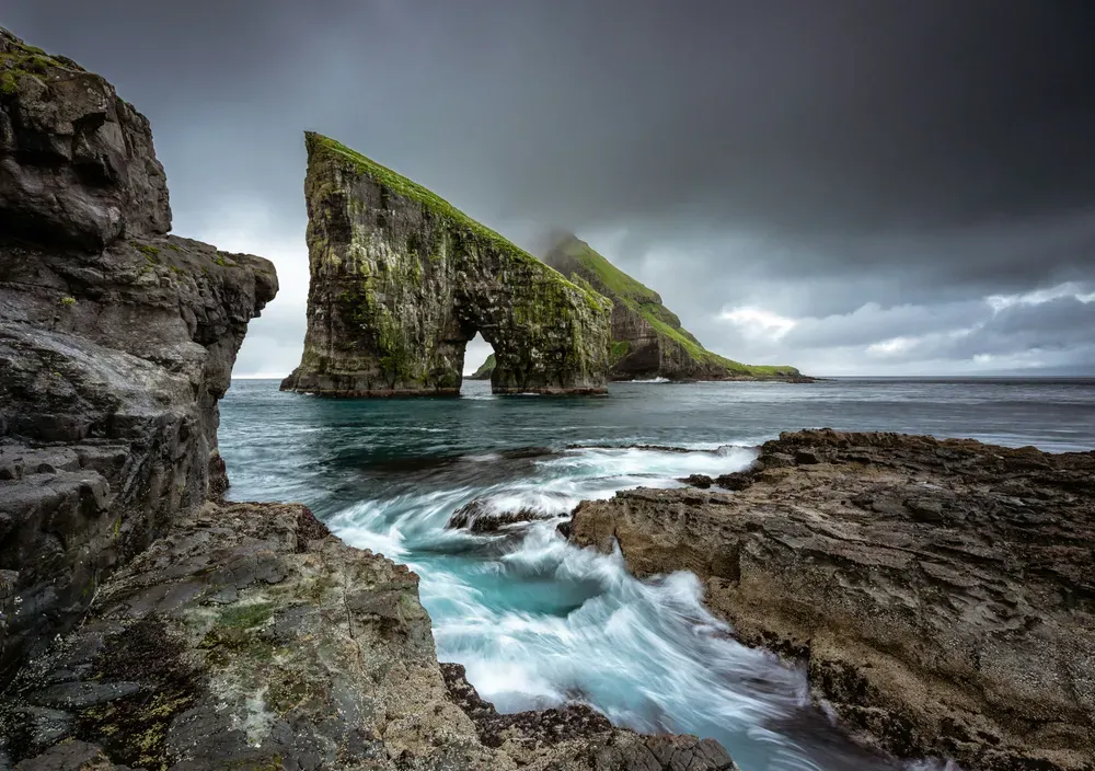 dramatic rocks rising from a stormy sea