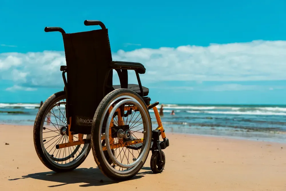empty wheelchair on a beach