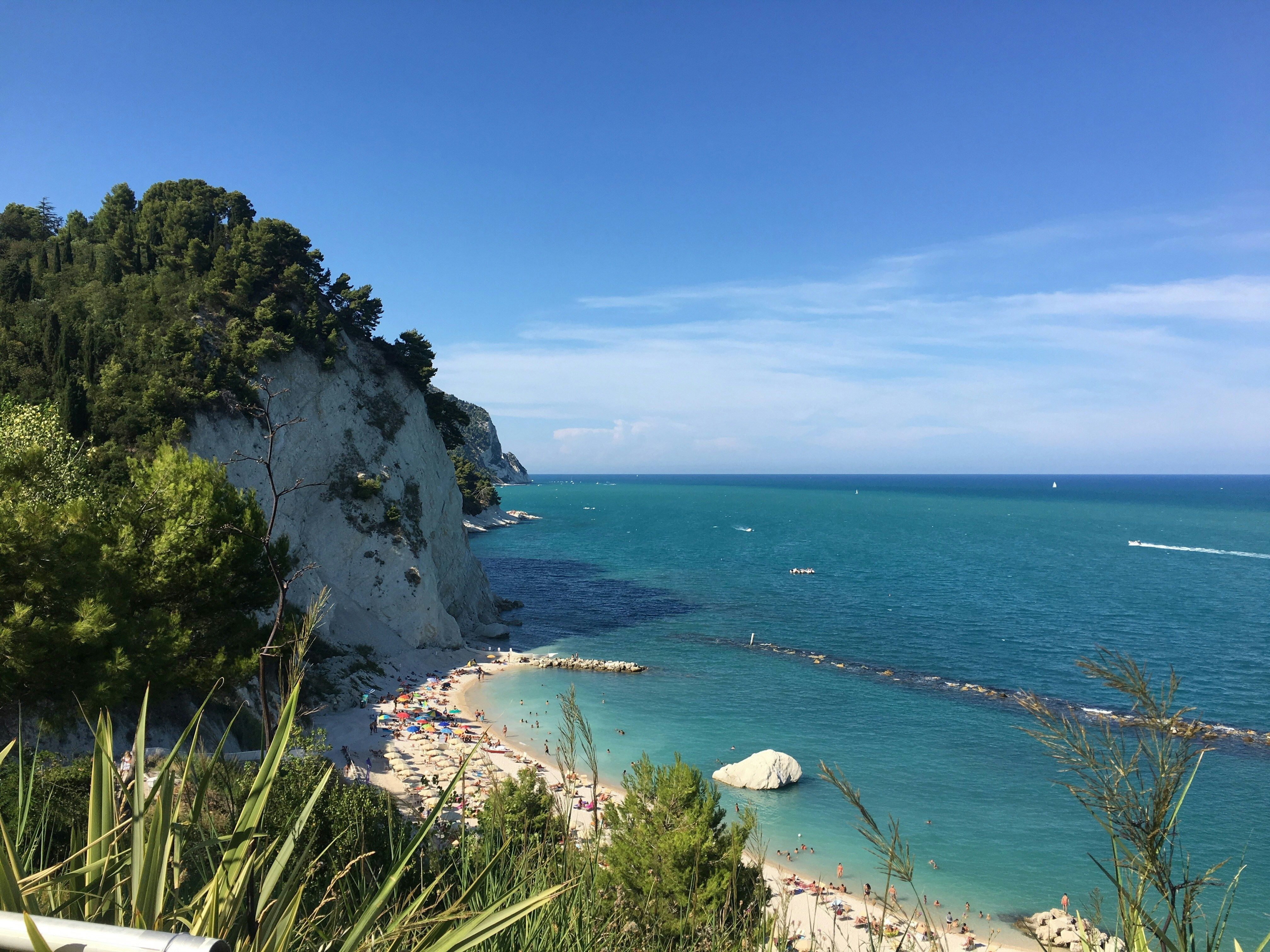 sandy bay next to the cliffs in Ancona