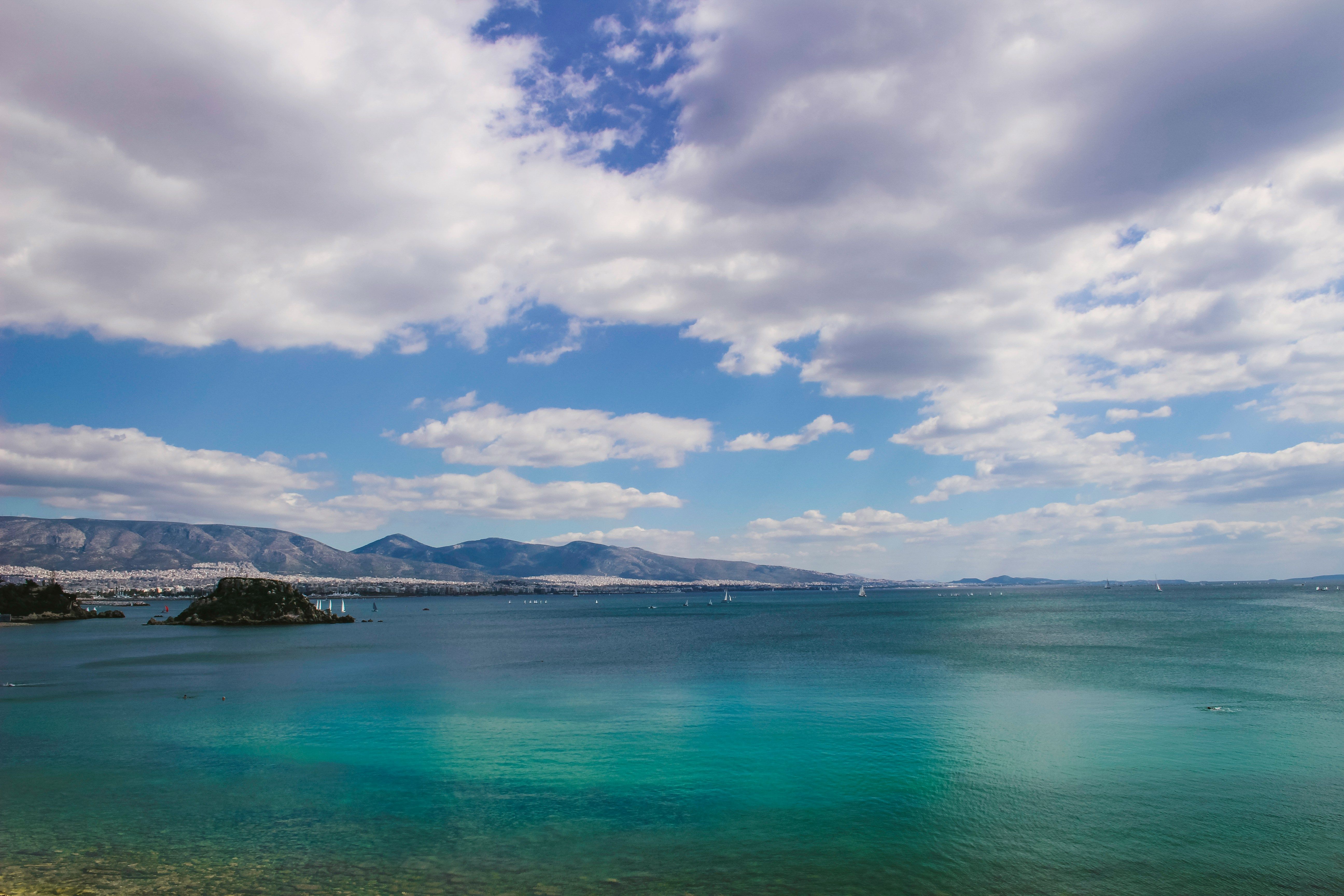 sea in Piraeus with mountains in the background