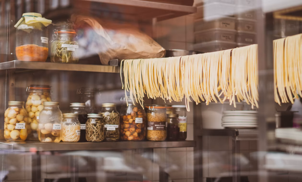 Fresh handmade pasta hanging in a kitchen