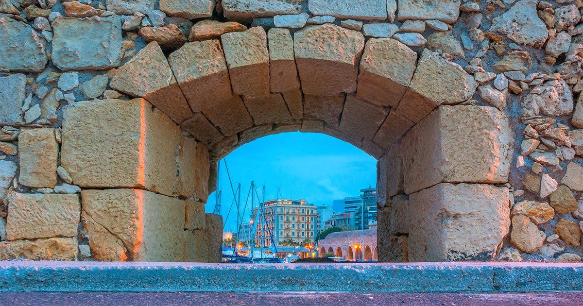 hole in a wall looking out onto Heraklion port
