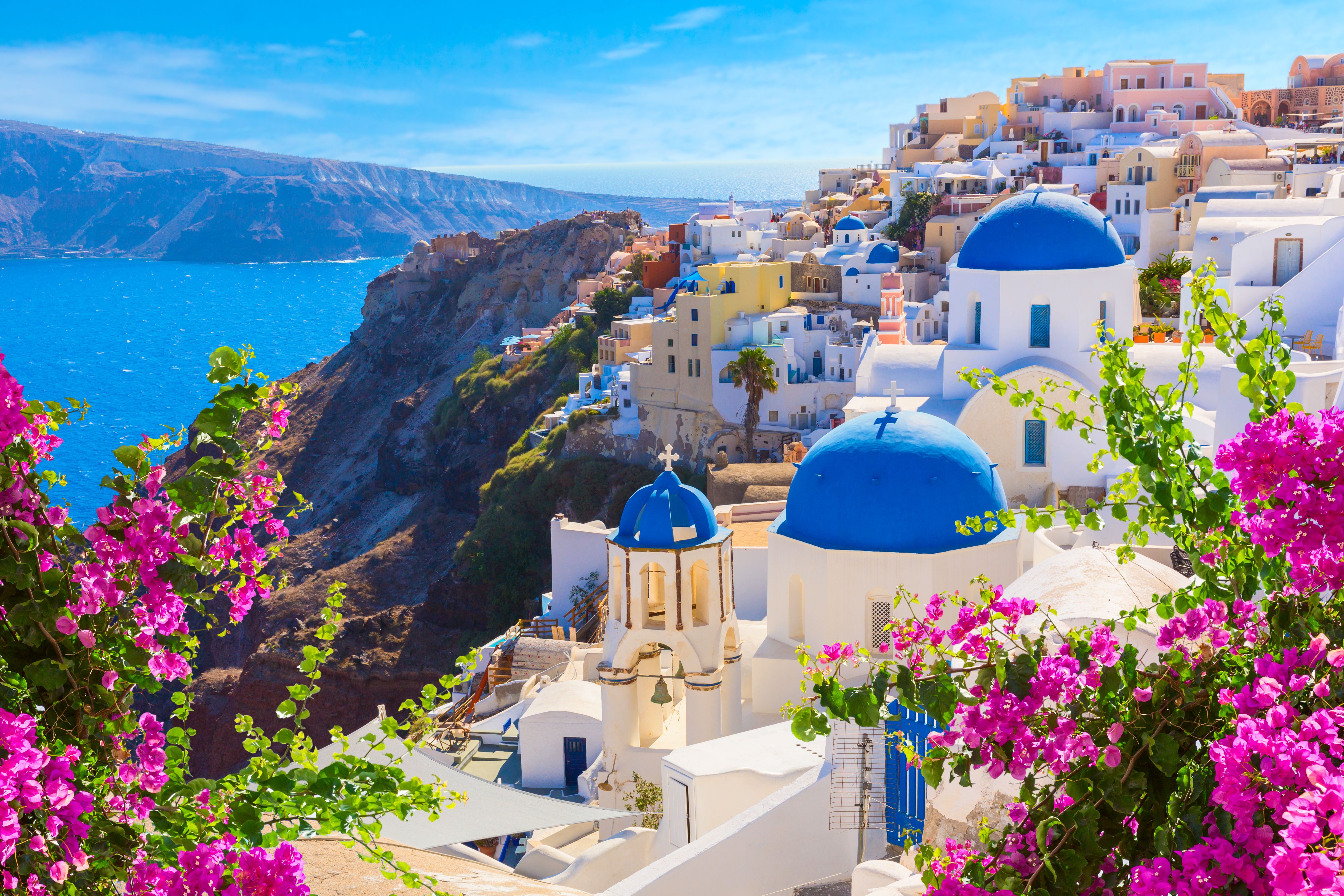 blue and white buildings on the cliff in Santorini
