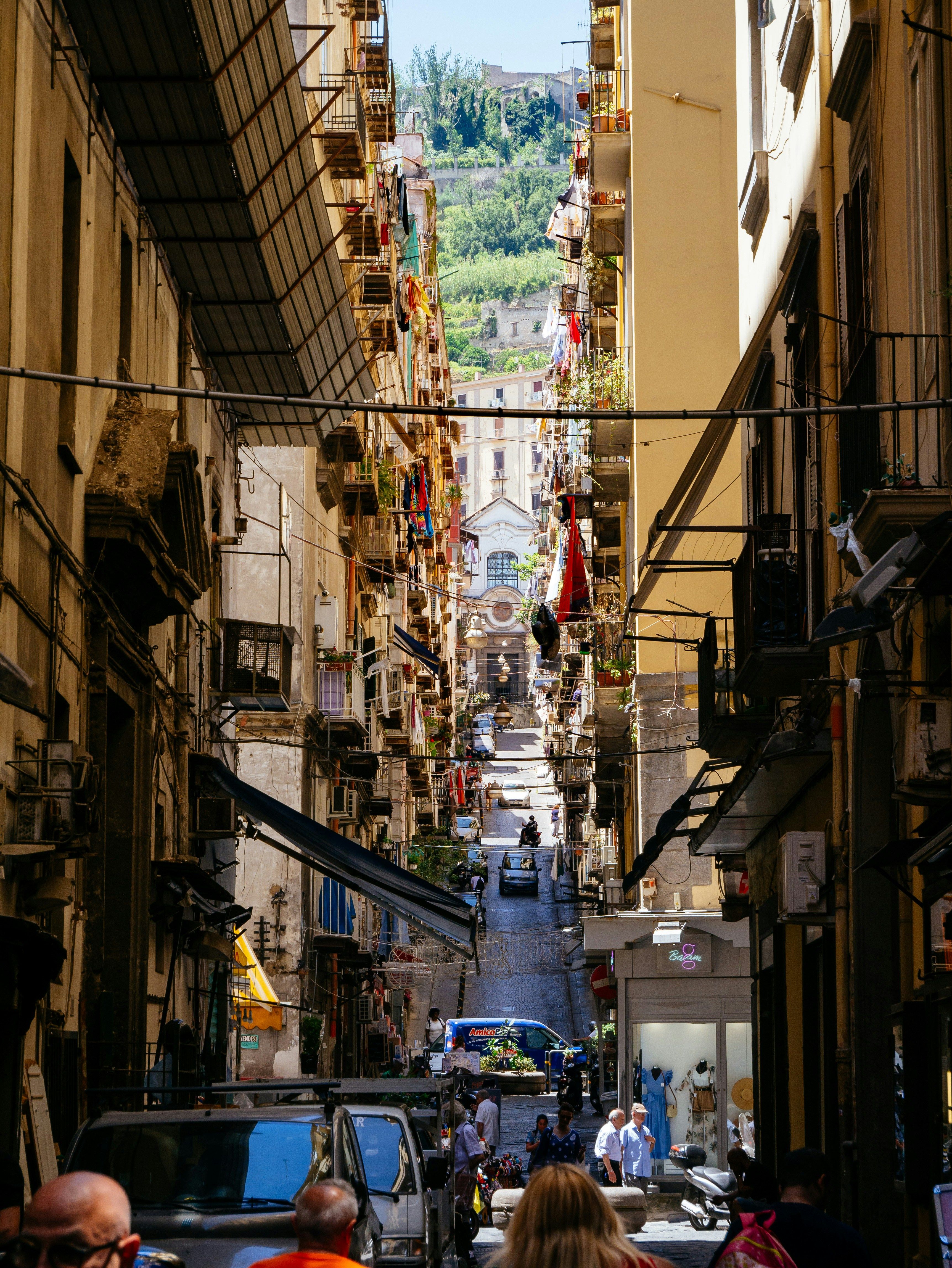 busy narrow steep street in Naples