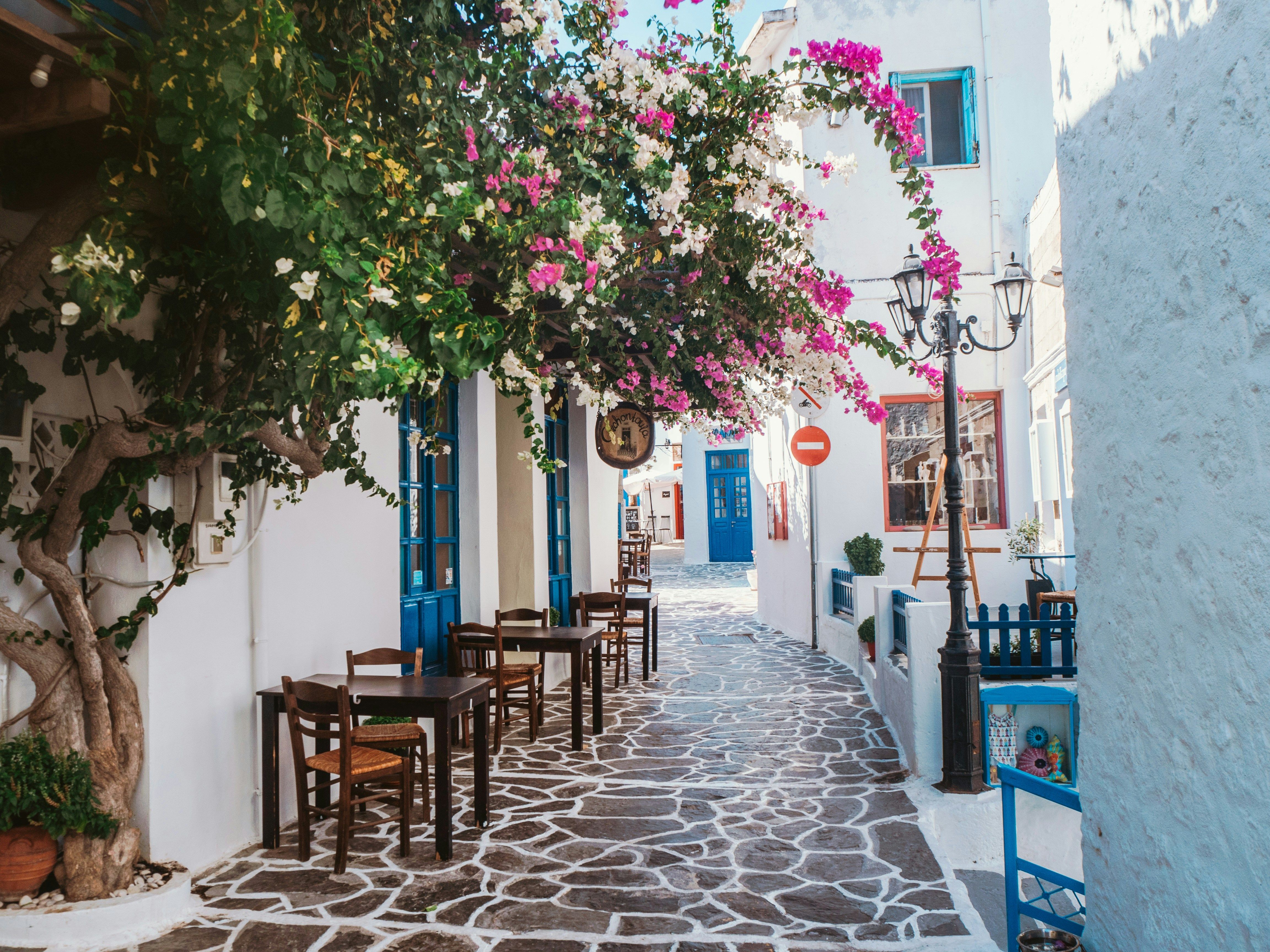 blue and white cobbled street in Milos