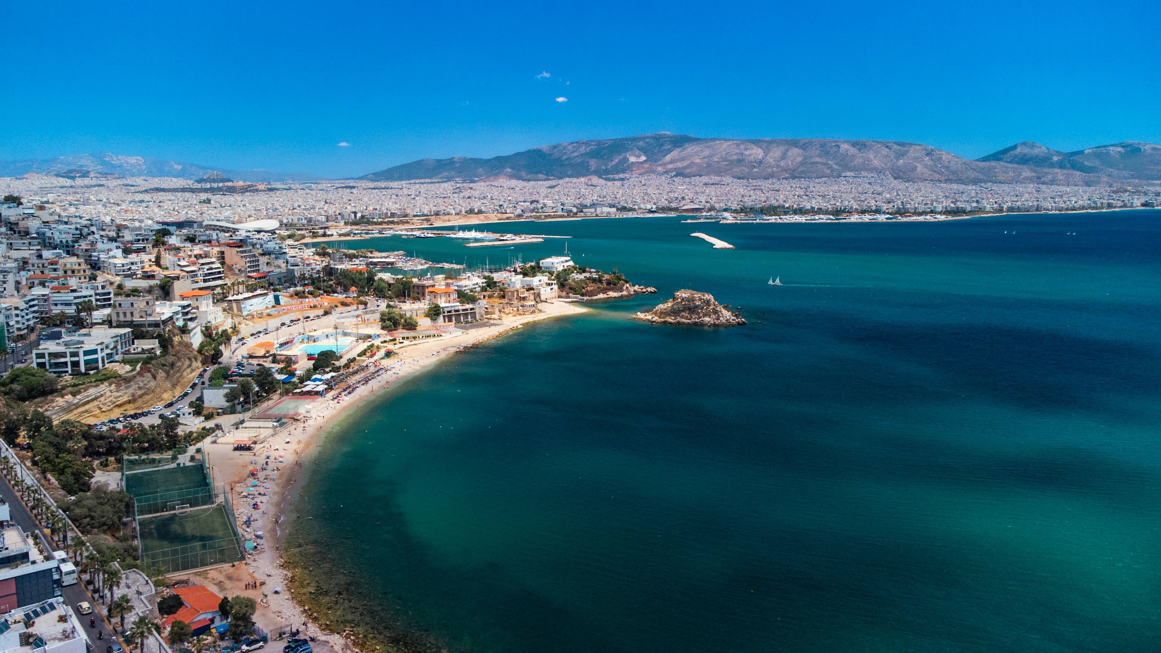 beach with the city of Piraeus behind