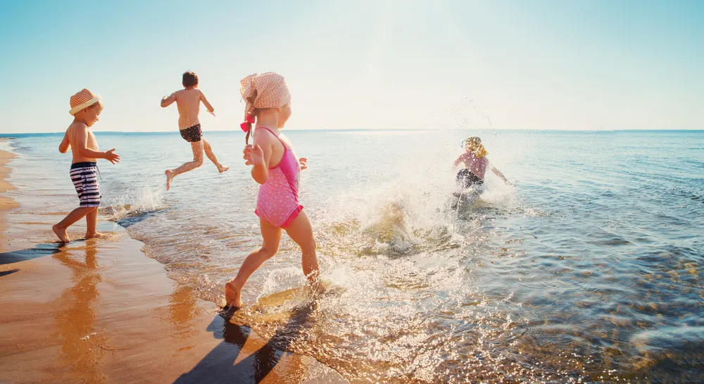 children playing in the sea