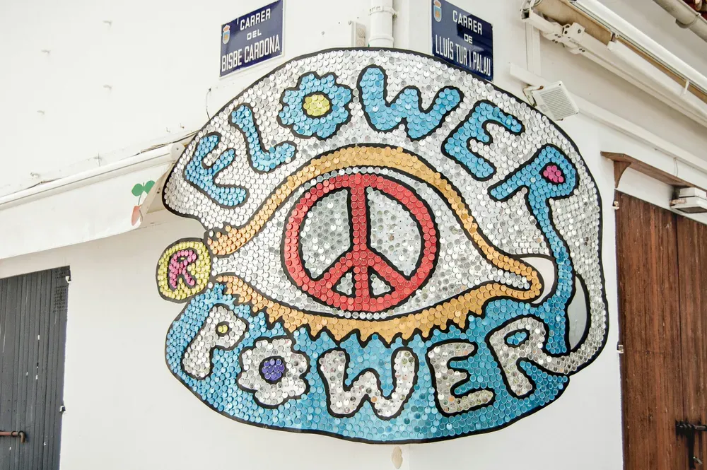 Flower power sign on a wall in Ibiza