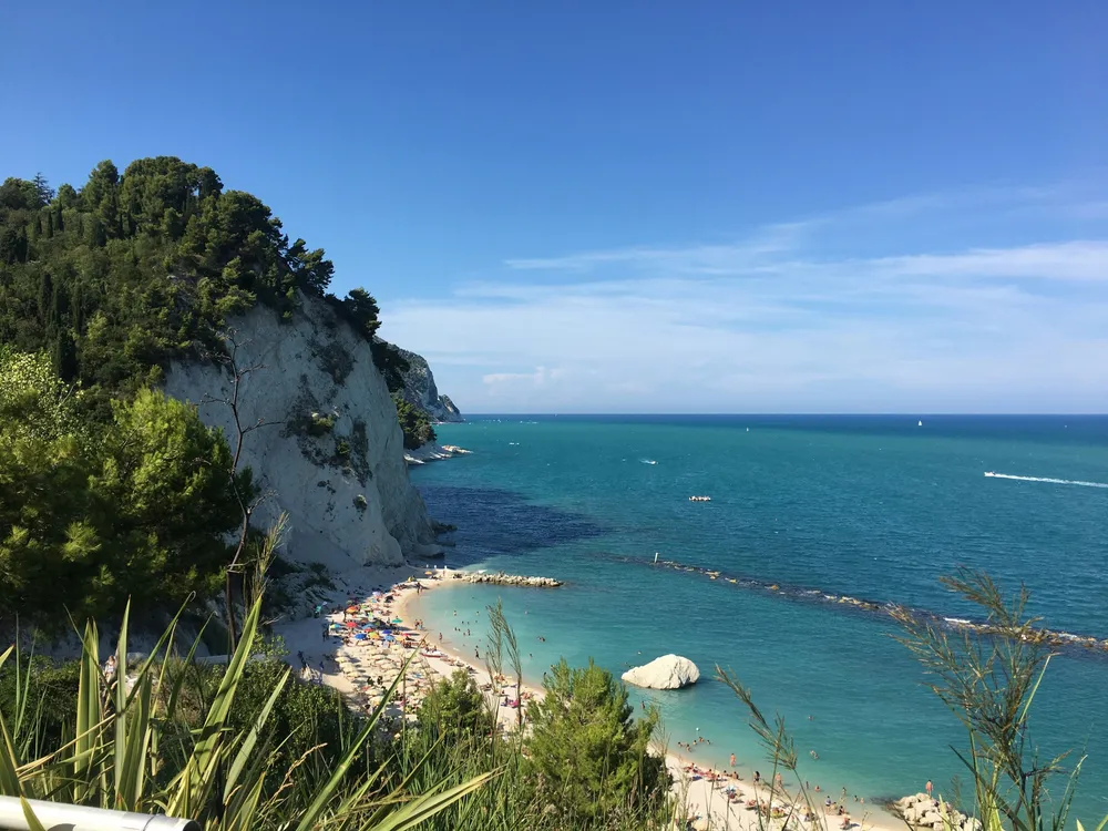 sandy bay next to a cliff in Ancona