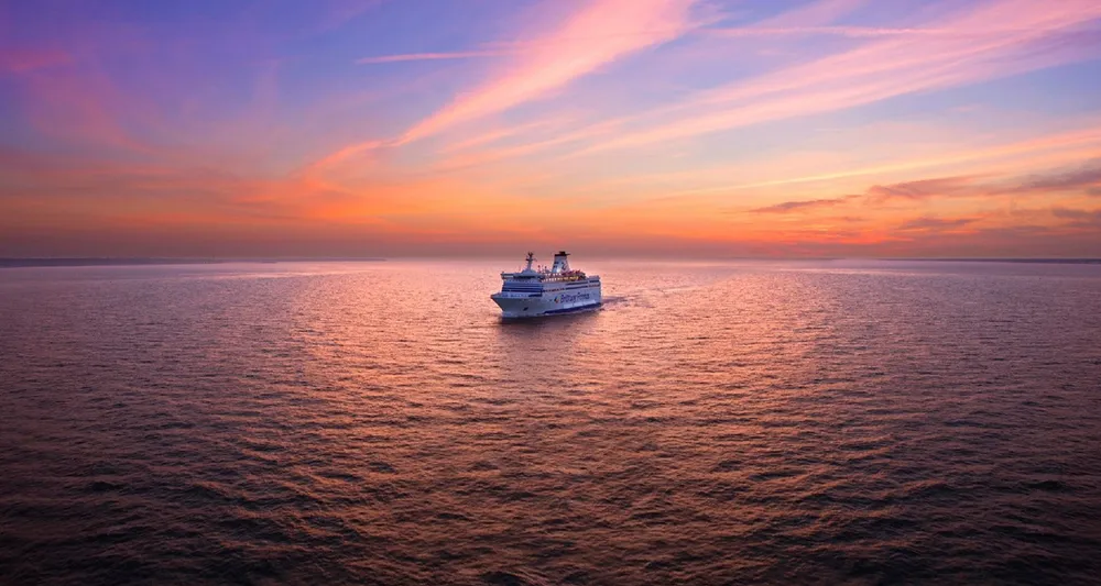 Brittany Ferries ship sailing at dusk