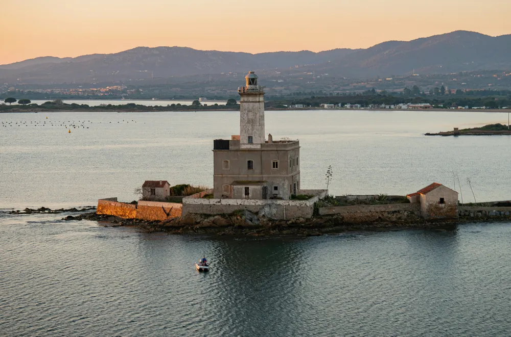 lighthouse on small island in the sea