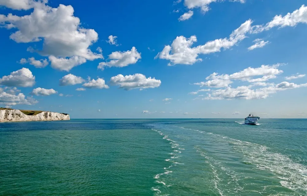 A ferry sailing past the white cliffs of Dover