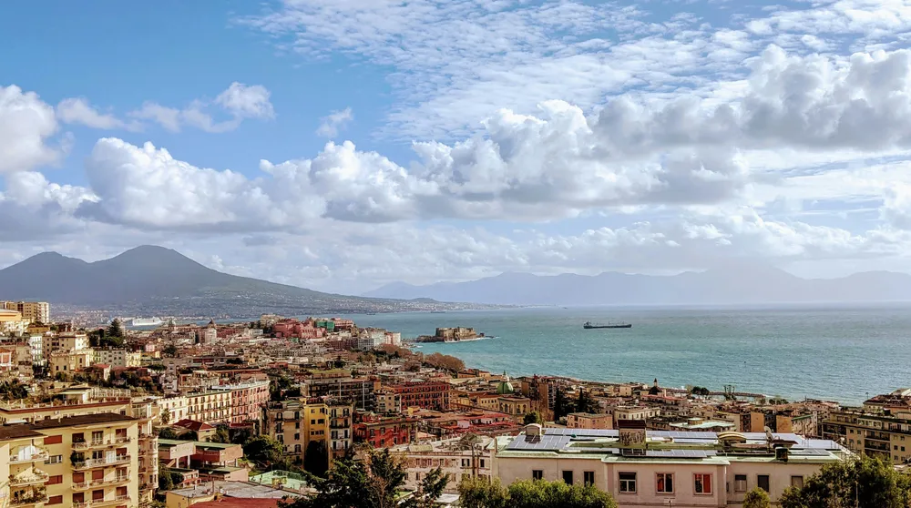 city of Naples with volcano in the background