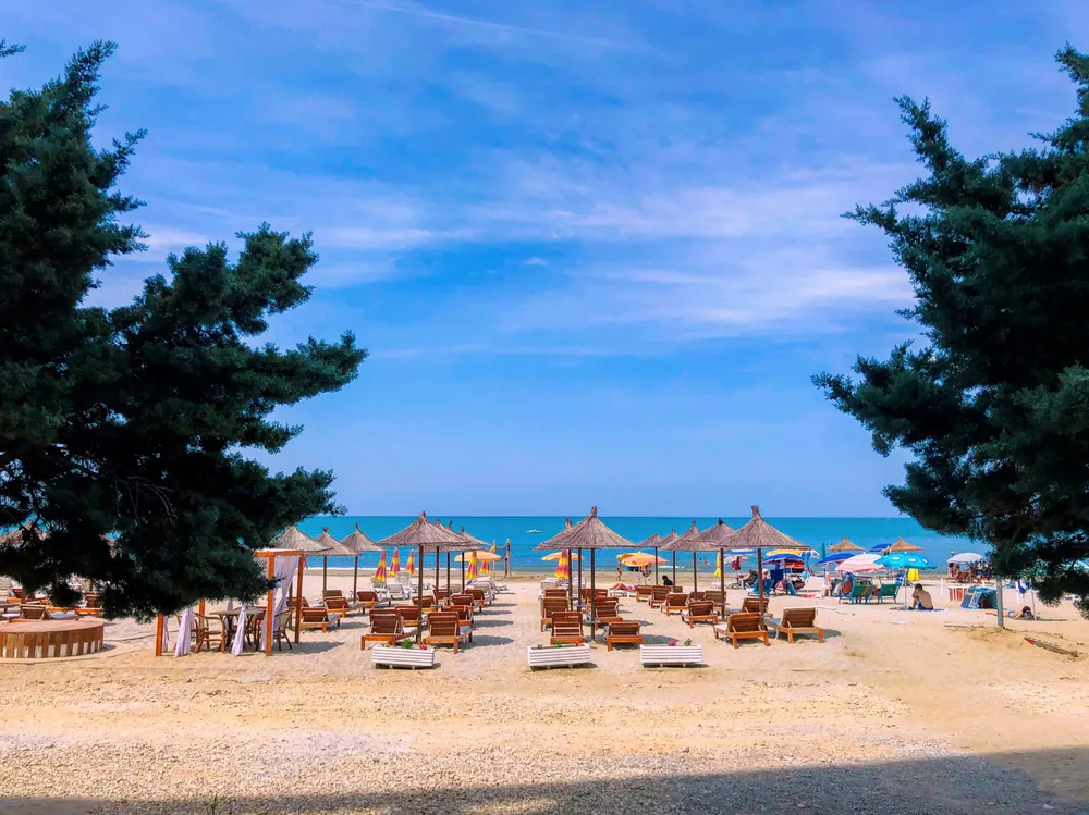 Loungers and umbrellas on a sandy beach in Durres