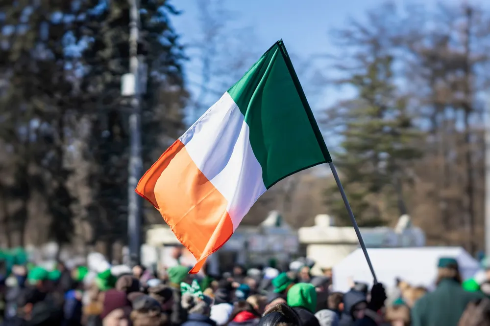 an Irish flag being waved during St Patrick celebrations