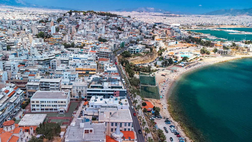 white buildings by the sea in Piraeus