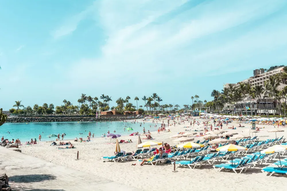 a busy beach in the Canary Islands