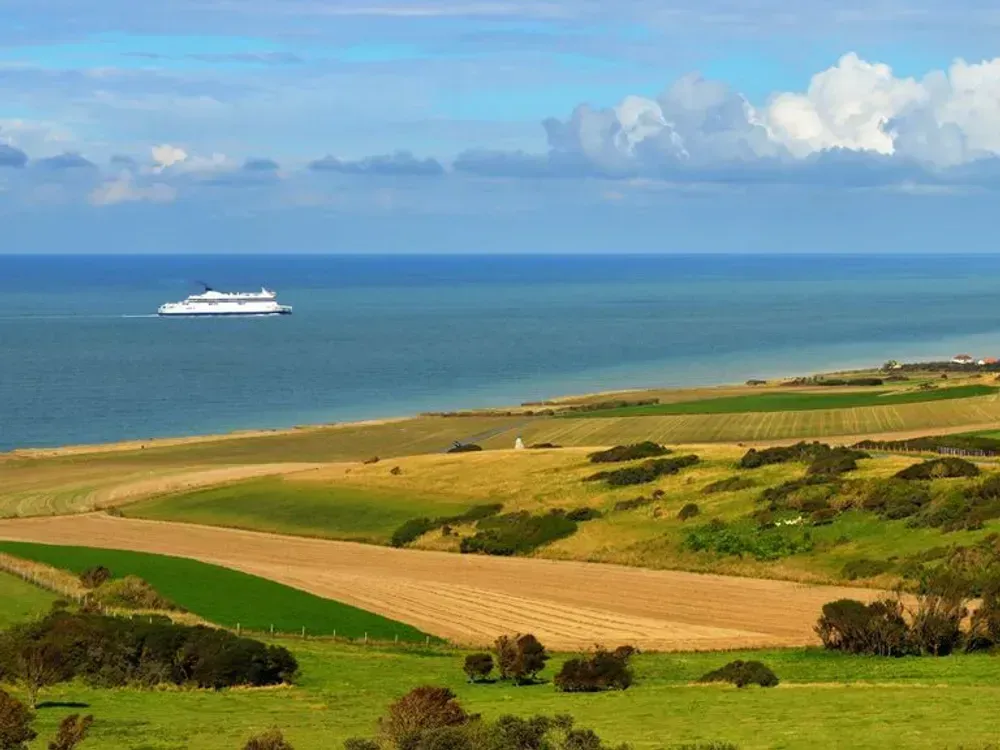 a ferry departing from Calais and sailing across the Channel