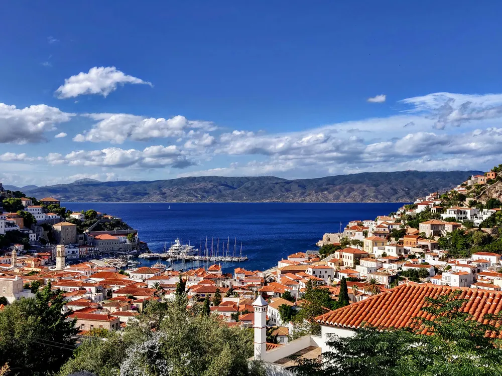 aerial view of buildings next to the sea in Hydra