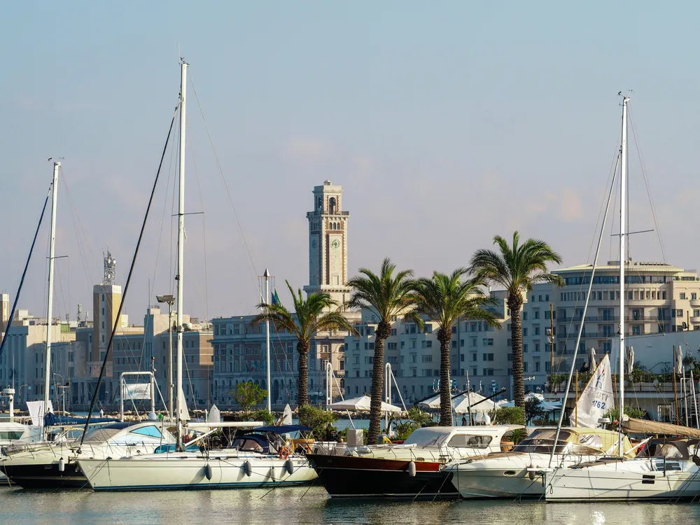 boats lined up by the harbour in Bari
