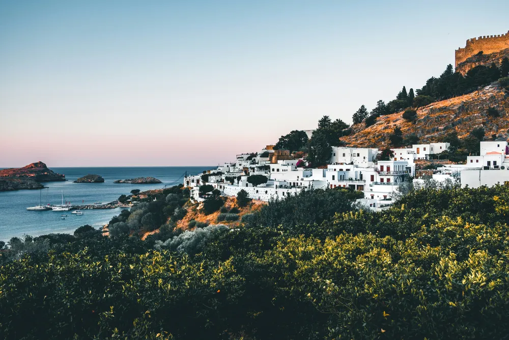 whitewashed houses on a hill overlooking the sea