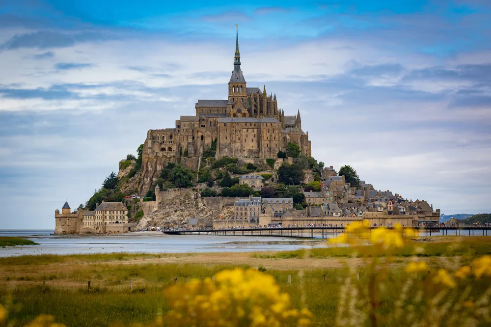 a majestic castle rising high into a blue sky