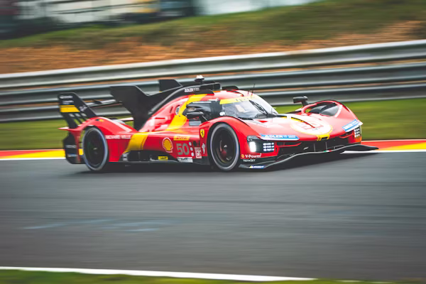 A Ferrari hypercar driving at high speed on Le Mans