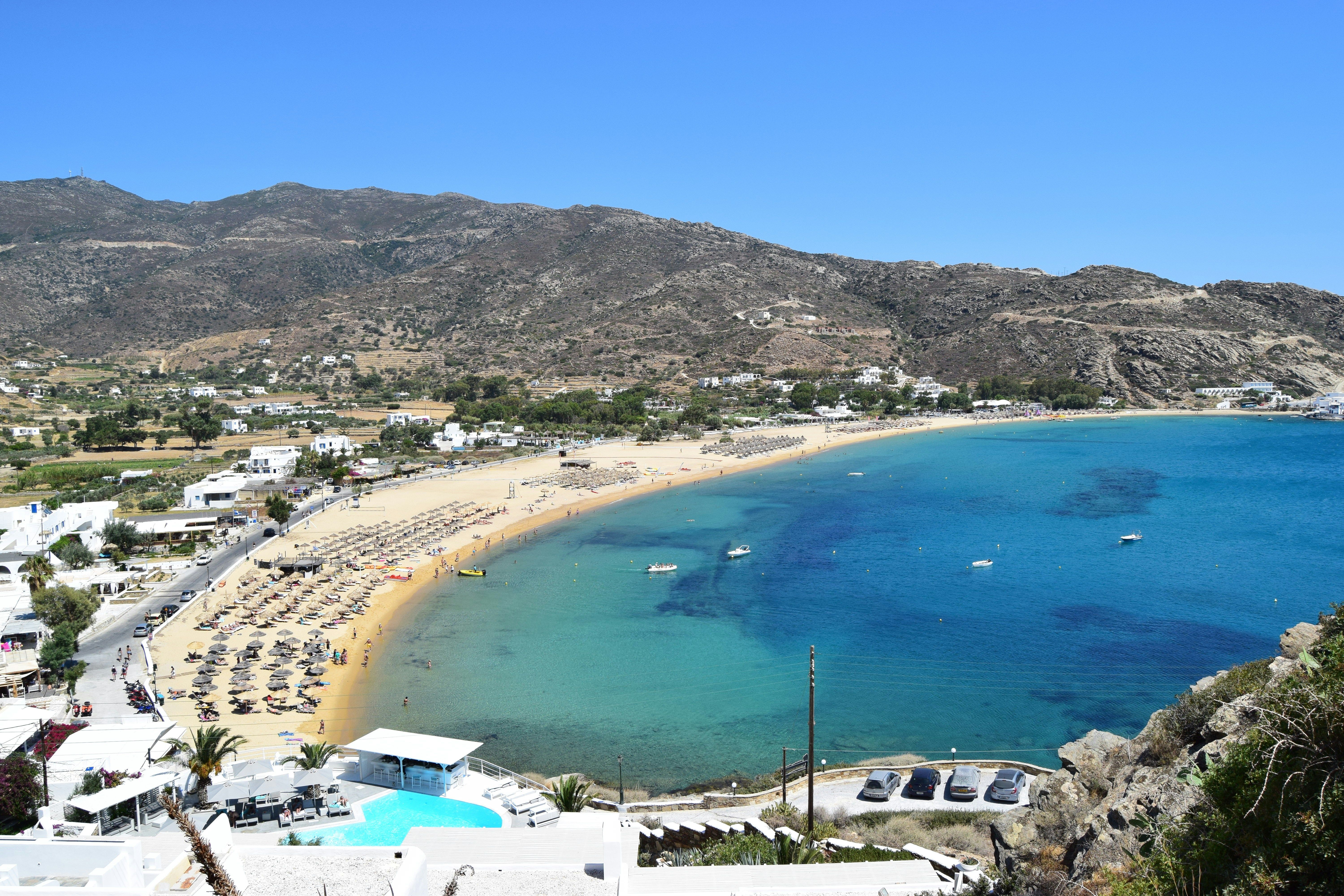 sandy beach next to the mountains in Ios