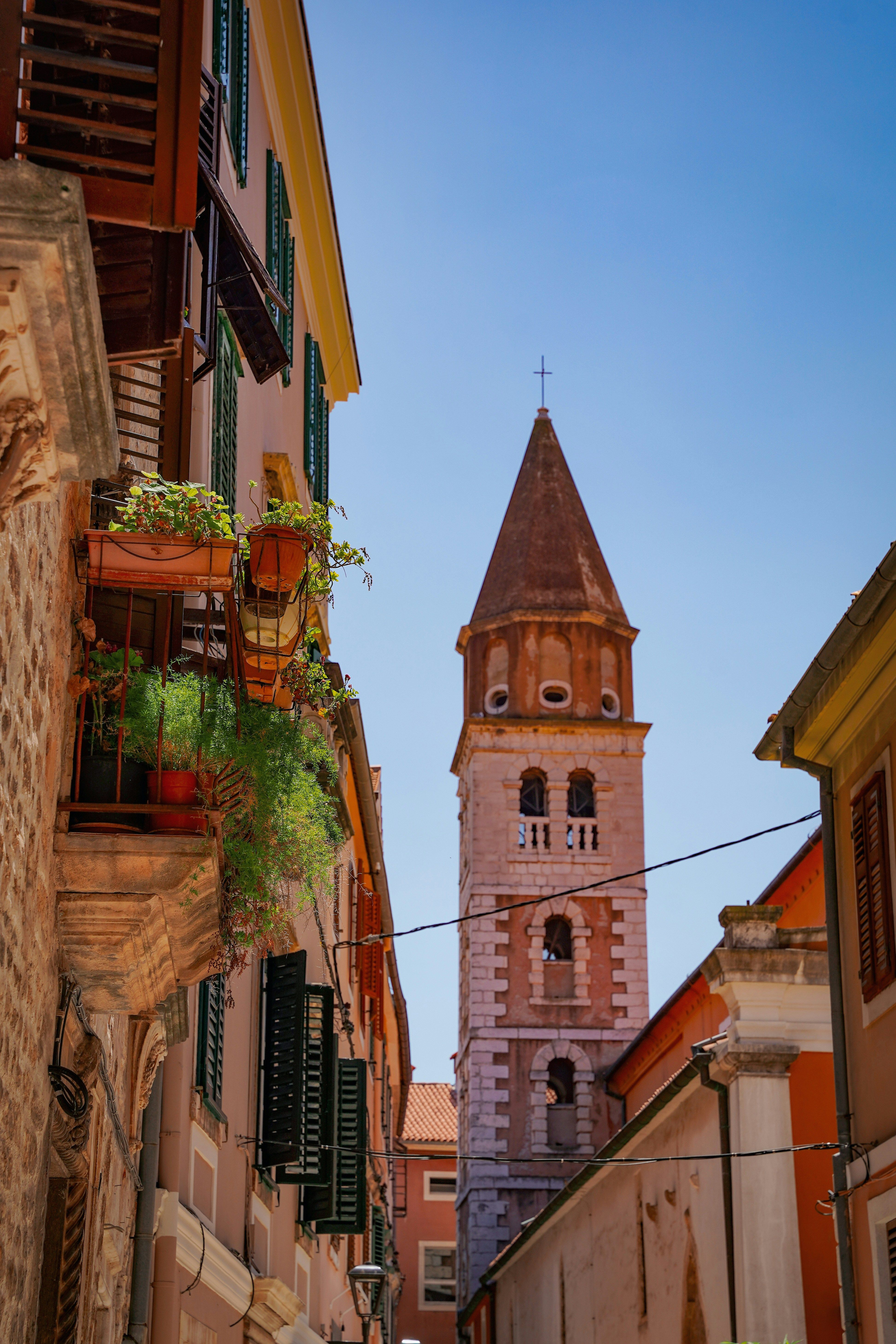 tall church in a narrow street in Zadar